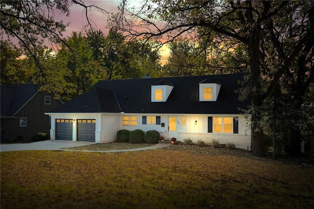 new england style home with a garage