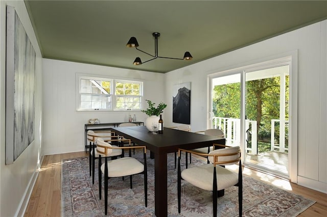 dining area with a chandelier and hardwood / wood-style floors