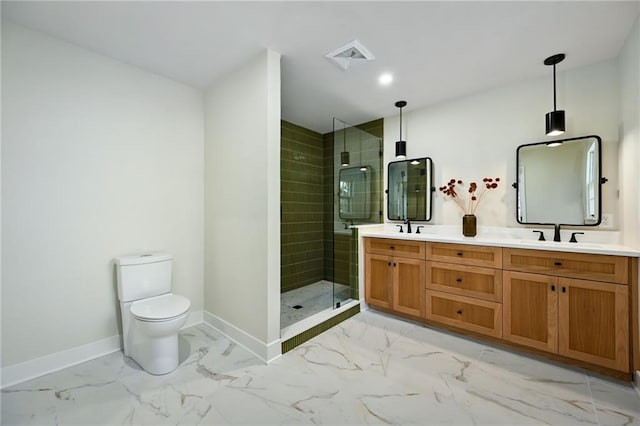 bathroom featuring vanity, toilet, and tiled shower