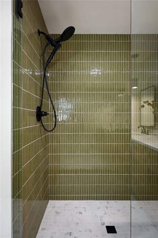 bathroom with a tile shower