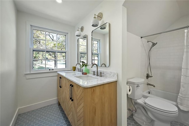 full bathroom featuring toilet, vanity, tile patterned floors, and shower / tub combo with curtain