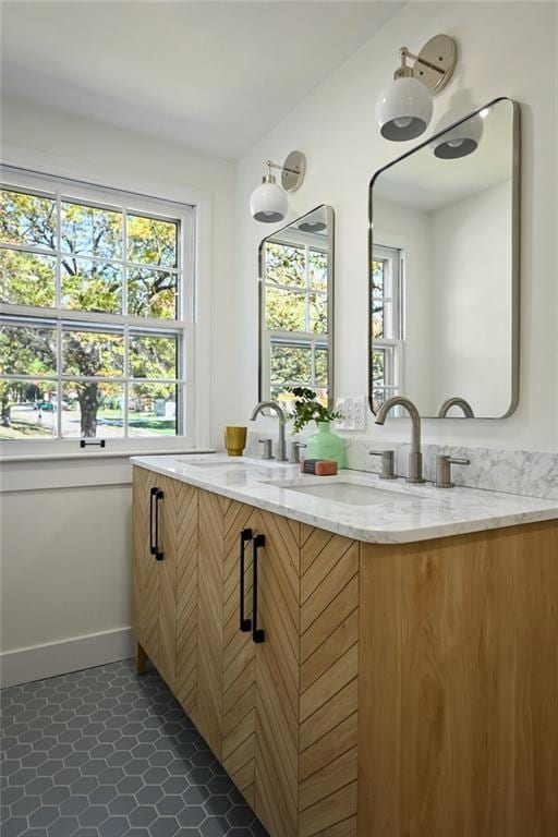 bathroom featuring tile patterned flooring and vanity