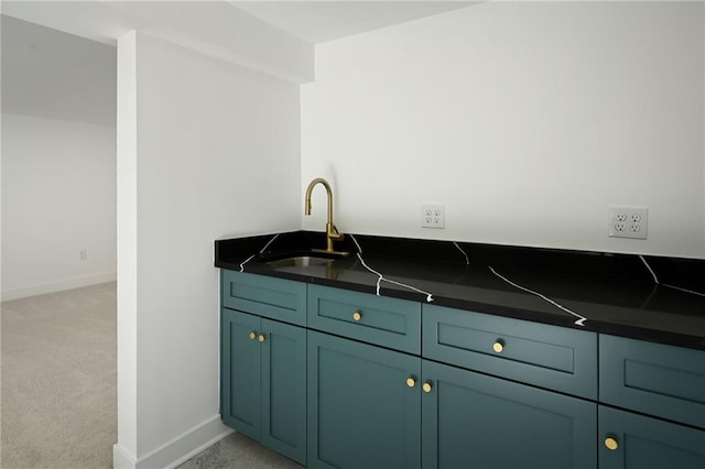 kitchen with light carpet and sink