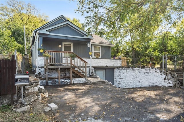 view of front of house featuring covered porch and a garage