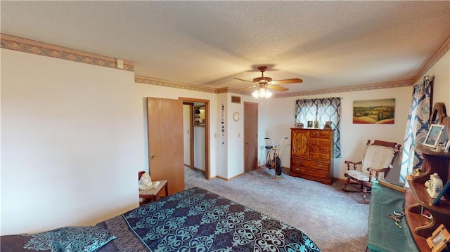 carpeted bedroom with a textured ceiling and ceiling fan