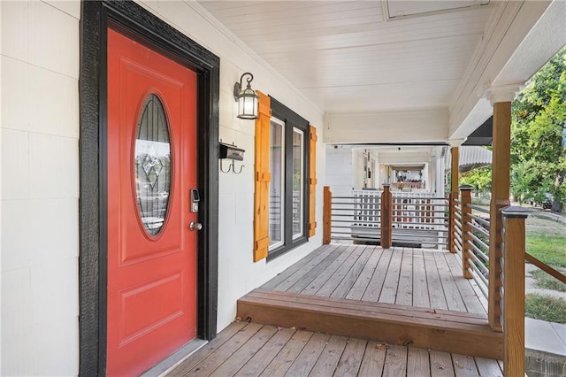 doorway to property featuring covered porch