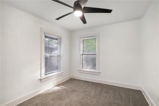 carpeted empty room featuring crown molding and ceiling fan