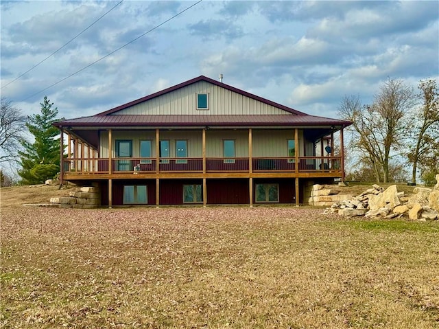 back of house with a yard