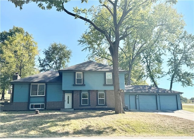 view of front facade with a front yard and a garage