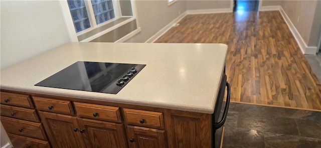 kitchen featuring black electric stovetop and dark hardwood / wood-style flooring