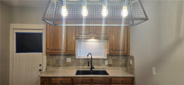 kitchen with backsplash and sink