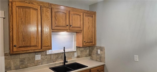 kitchen featuring backsplash and sink