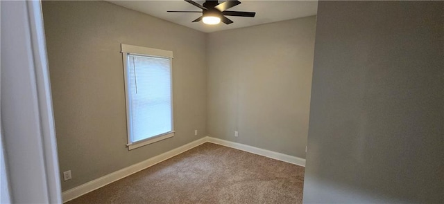 empty room featuring plenty of natural light, ceiling fan, and carpet floors