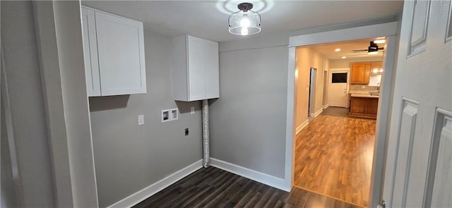 laundry room featuring electric dryer hookup, cabinets, hookup for a washing machine, ceiling fan, and dark hardwood / wood-style floors