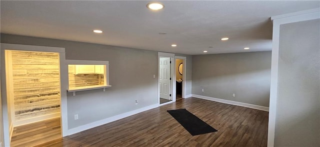 unfurnished room featuring dark hardwood / wood-style flooring