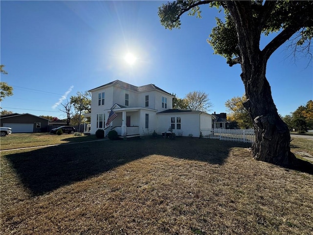 view of side of home featuring a lawn