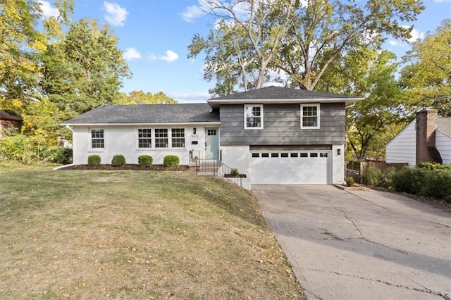 view of front of house featuring a front yard and a garage