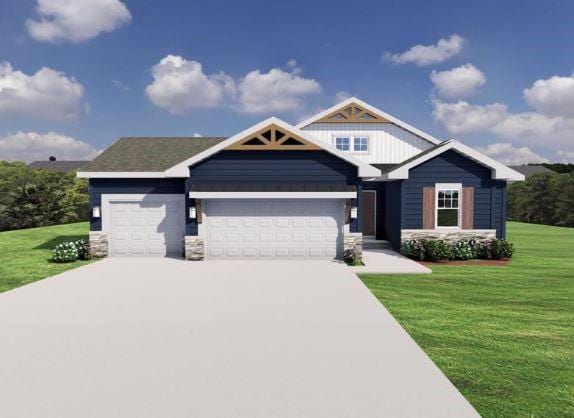 craftsman-style home featuring a front yard and a garage