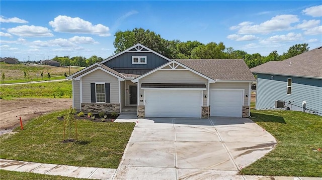 craftsman inspired home with an attached garage, stone siding, driveway, and board and batten siding