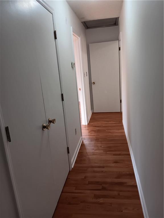 305 18th Ave N, Greenwood, MO 63034 - hallway with baseboards and wood finished floors