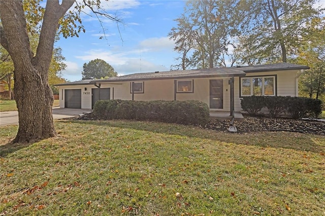 single story home featuring a front lawn and a garage