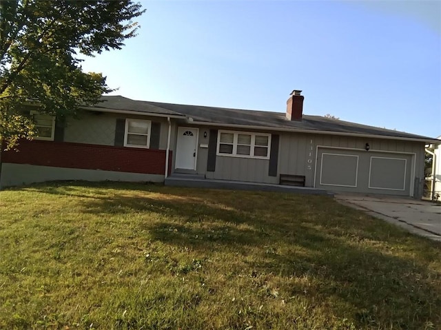 single story home with a garage and a front lawn