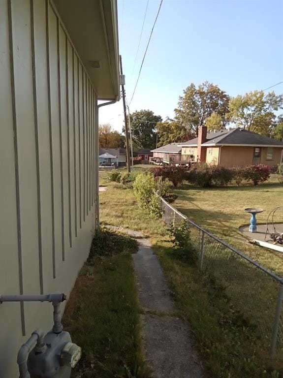 view of side of property featuring a yard