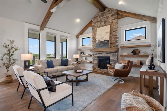 living room with beam ceiling, hardwood / wood-style flooring, high vaulted ceiling, and a fireplace