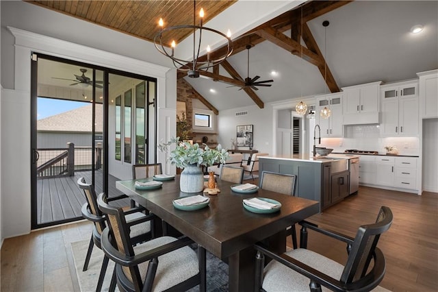 dining space with beamed ceiling, high vaulted ceiling, light wood-type flooring, and wooden ceiling