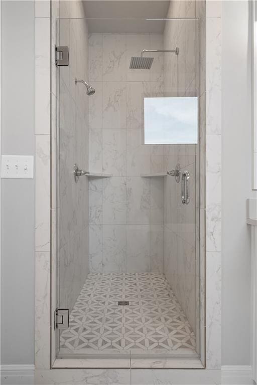 bathroom featuring an enclosed shower