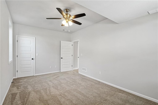 carpeted empty room with ceiling fan