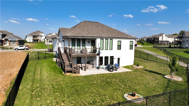 back of property with a patio area and a lawn