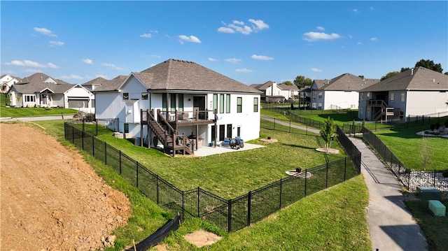 rear view of property with a patio area and a yard