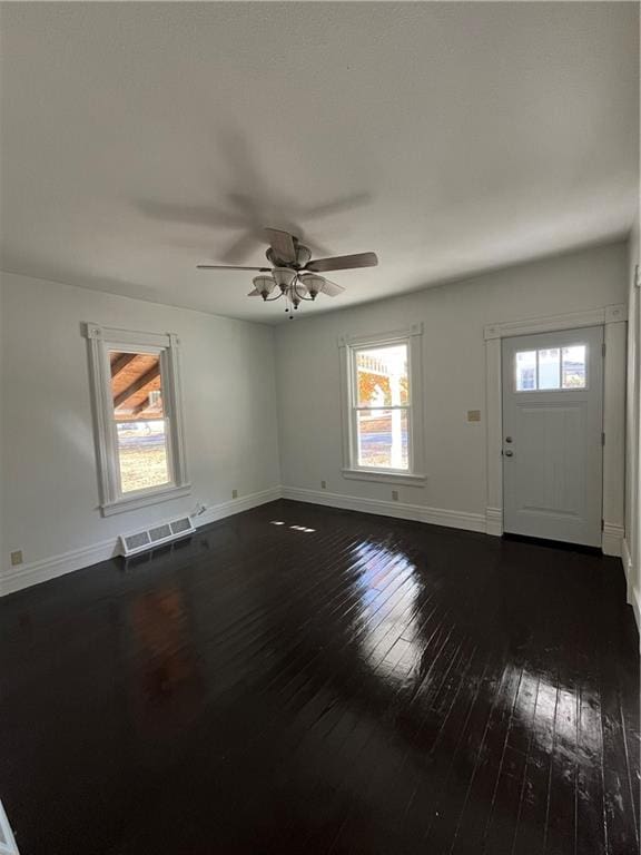 foyer featuring ceiling fan and dark hardwood / wood-style flooring