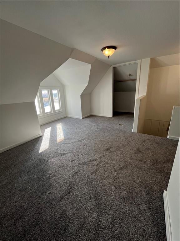 bonus room featuring carpet and lofted ceiling