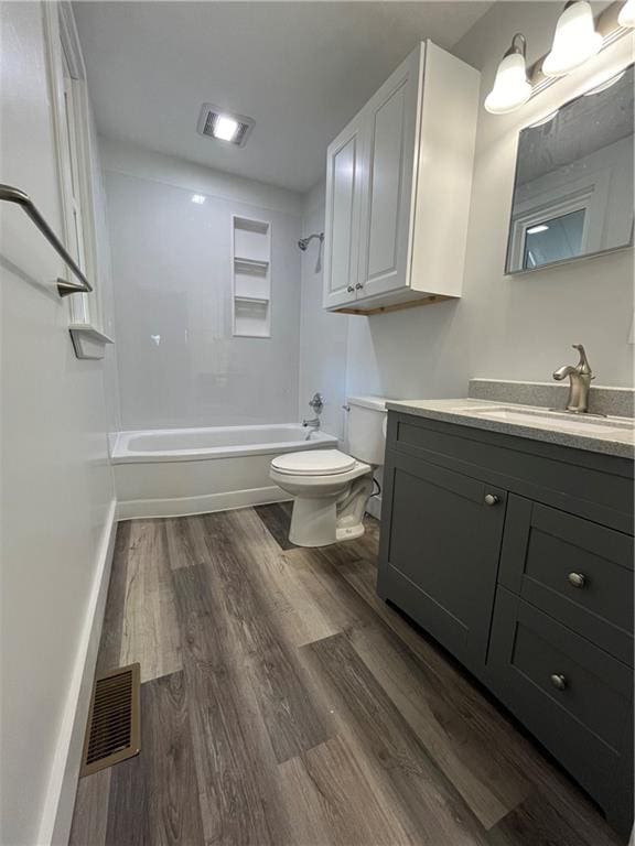 full bathroom featuring vanity, toilet, shower / bathing tub combination, and hardwood / wood-style floors