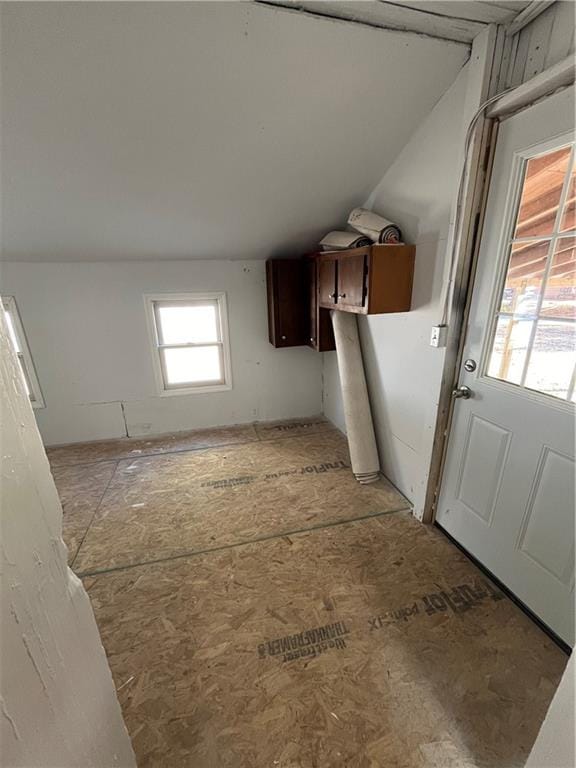 interior space with vaulted ceiling and dark brown cabinets