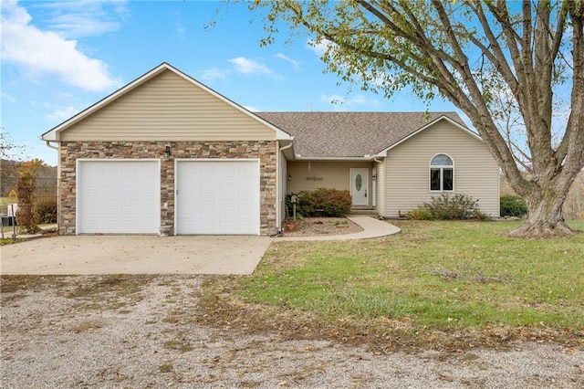 ranch-style home with a garage and a front yard