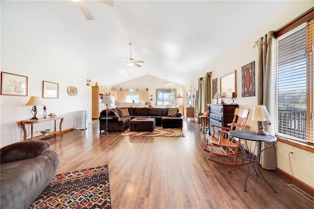 living room with hardwood / wood-style flooring, vaulted ceiling, and ceiling fan