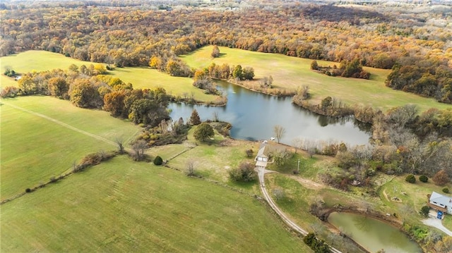 birds eye view of property with a rural view and a water view