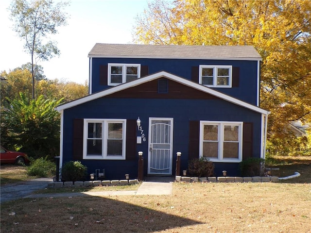 view of front of property with a front lawn