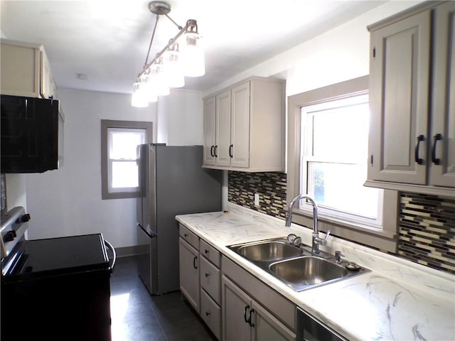 kitchen with gray cabinetry, sink, backsplash, electric range oven, and pendant lighting