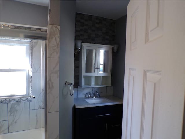 bathroom with vanity and plenty of natural light