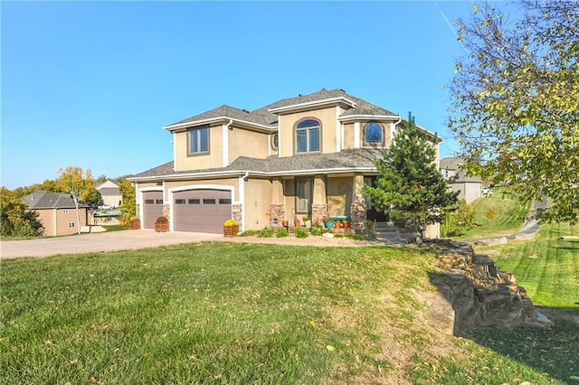 view of front facade featuring a front yard and a garage