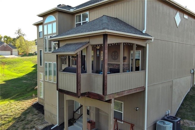 exterior space featuring a yard and central AC unit