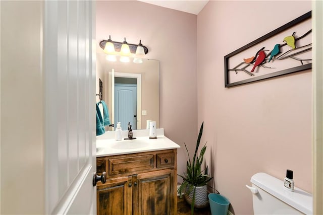 bathroom with vanity and toilet