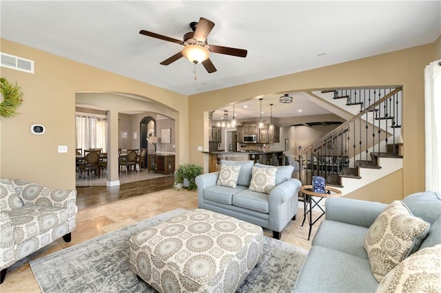 living room with ceiling fan