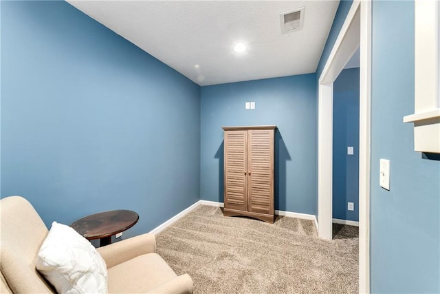 sitting room with carpet flooring