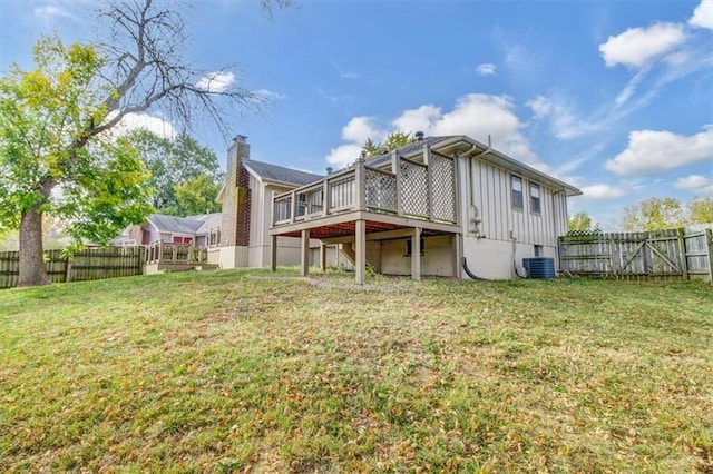 rear view of house featuring a yard, a deck, and central air condition unit