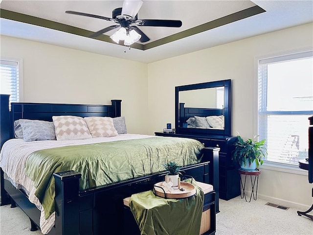 bedroom featuring ceiling fan and light colored carpet